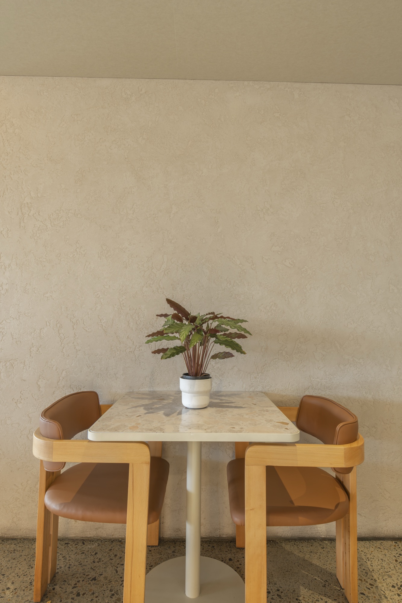 Two top marble table with potted plant