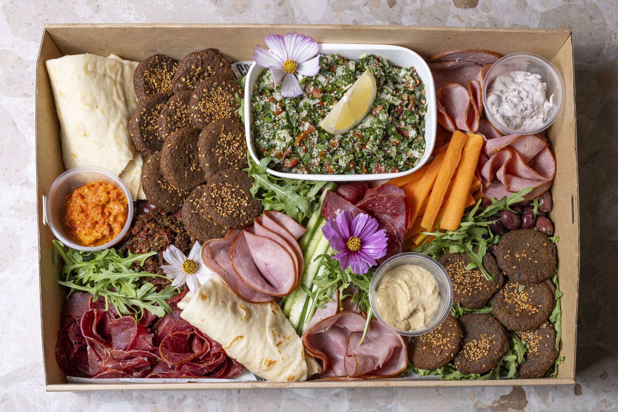 Mediterranean Box with falafels hummus tabbouleh and cured meats